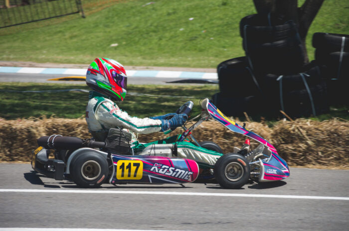  A person in a kart taking part in an outdoor team activity