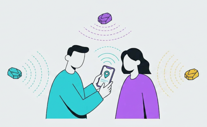 Two persons playing with a phone that's connected with 3 ibeacons